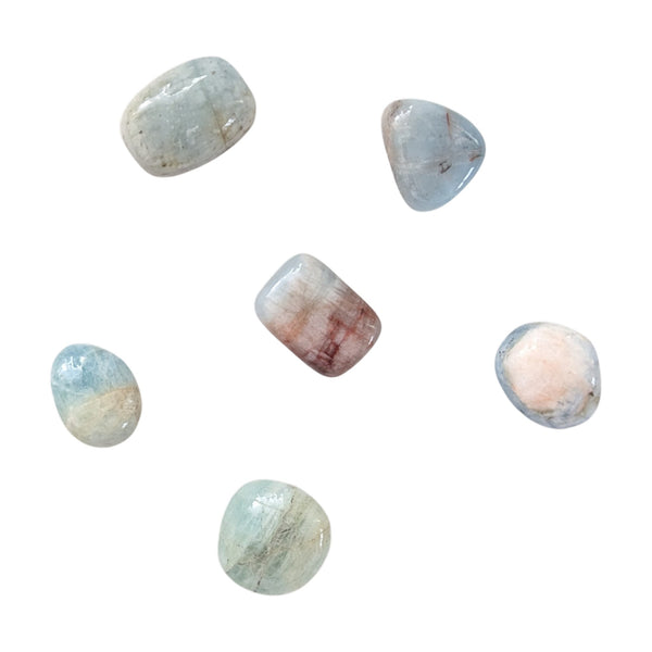 Aquamarine smooth gemstones showcasing the natural colour inclusions. 