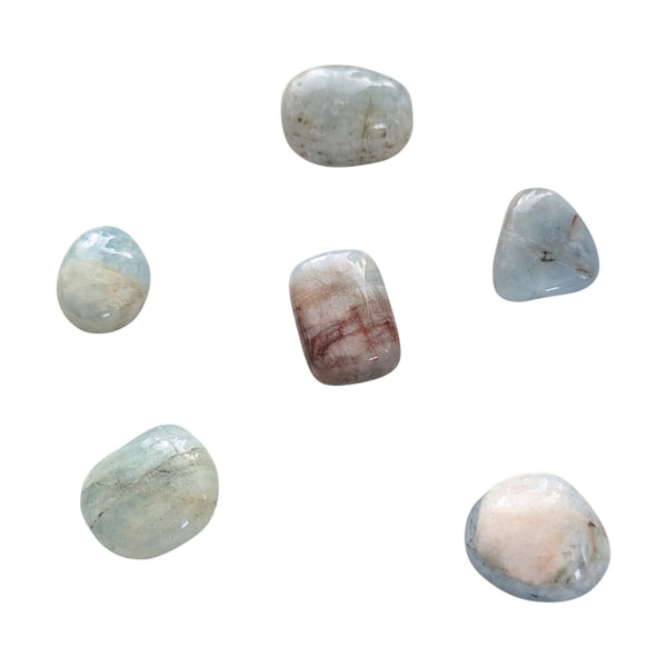 Aquamarine tumbled stones in shade of blue and green. 