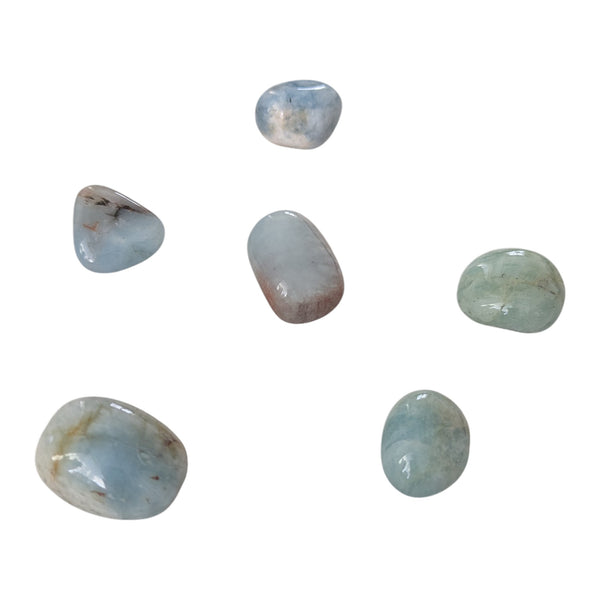 Aquamarine tumblestones in varying shade of blue. 