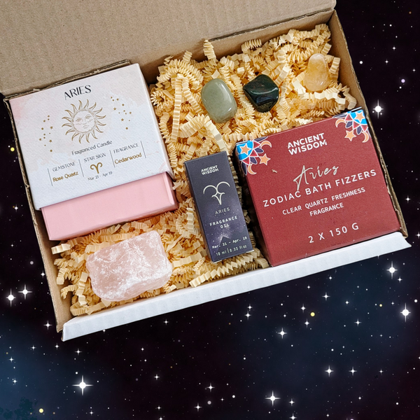 Aries gift box containing; crystal candle, fragrance oil, bath fizzers, crystal tumblestones and raw rose quartz. 