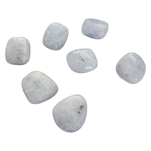 Blue Calcite smooth polished stones showing pale blue to deeper blue tones. 