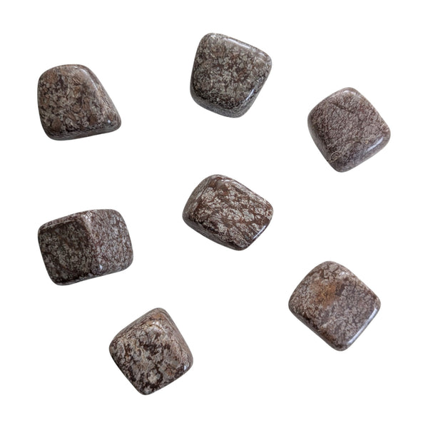Tumbled brown snowflake obsidian stones featuring feathery white inclusions