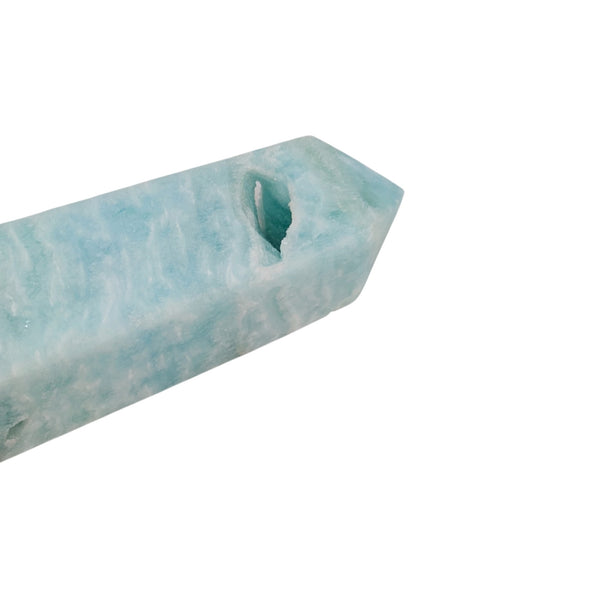 Close up of a Caribbean Calcite generator point, showing the natural cavity druzys. 