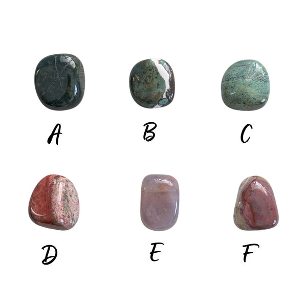 smooth judys jasper tumbled stones showcasing a variety of tones from deep red, to green and opaque. 