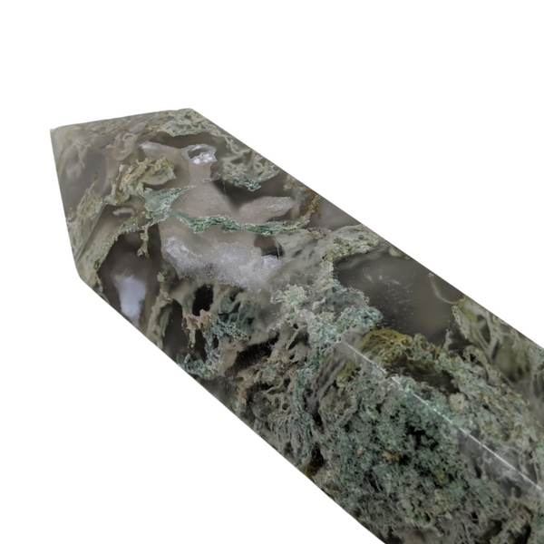polished green crystal generator with inclusions
