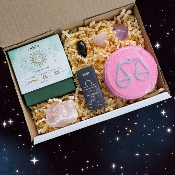 Libra Gift Box including; crystal tumblestones, raw rose quartz, fragrance oil, bath fizzer and crystal candle. 
