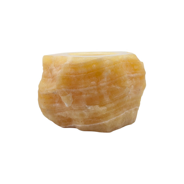 Rough and polished orange calcite candle holder in vibrant orange tones