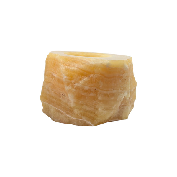 Small Orange Calcite natural candle holder with unpolished sides and a highly polished top. 