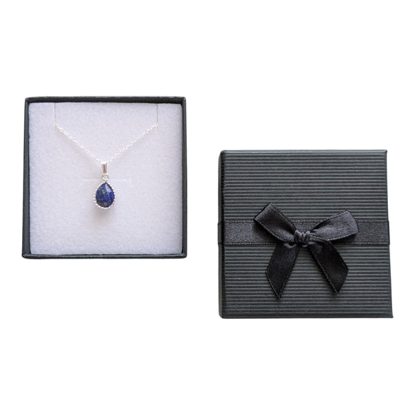 Pear drop charm lapis lazuli necklace, sterling silver chain in a black gift box with a small bow to the front. 
