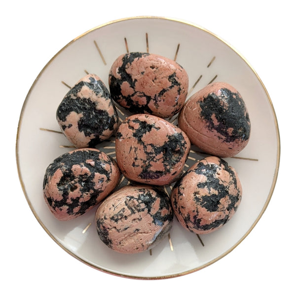 Luxullianite crystal tumblestones, pink granite with black tourmaline inclusions