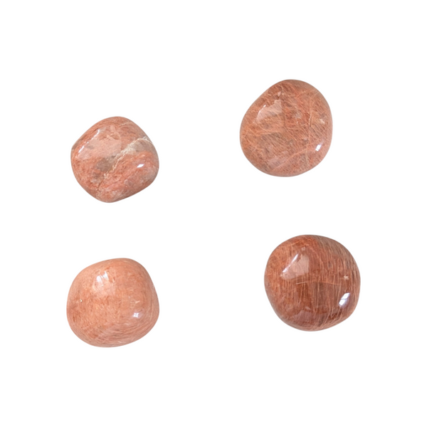 Peach Moonstone tumbled stone displaying light and dark peach tones. 