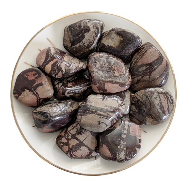 Polished Pink Spider Web Jasper crystal tumblestones, displaying intricate web like patterning.  