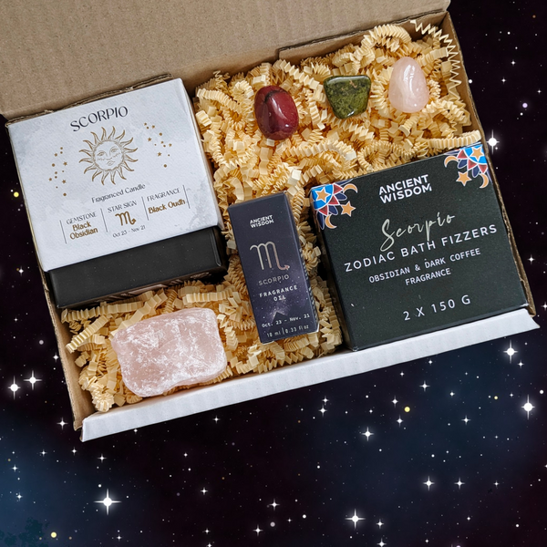 Scorpio Gift Box including; crystal candle, fragrance oil, two bath bombs, raw rose quartz and 3 crystal tumblestones. 