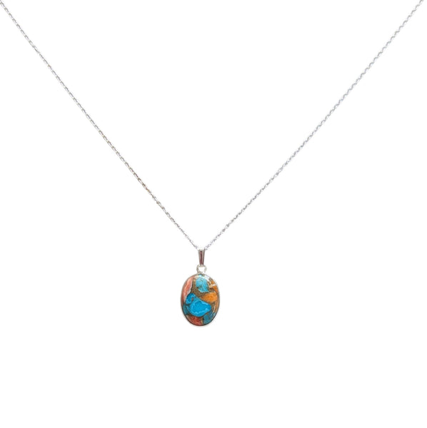 a 925 sterling silver chain featuring a oval pendant filled with Spiny Oyster Turquoise. 